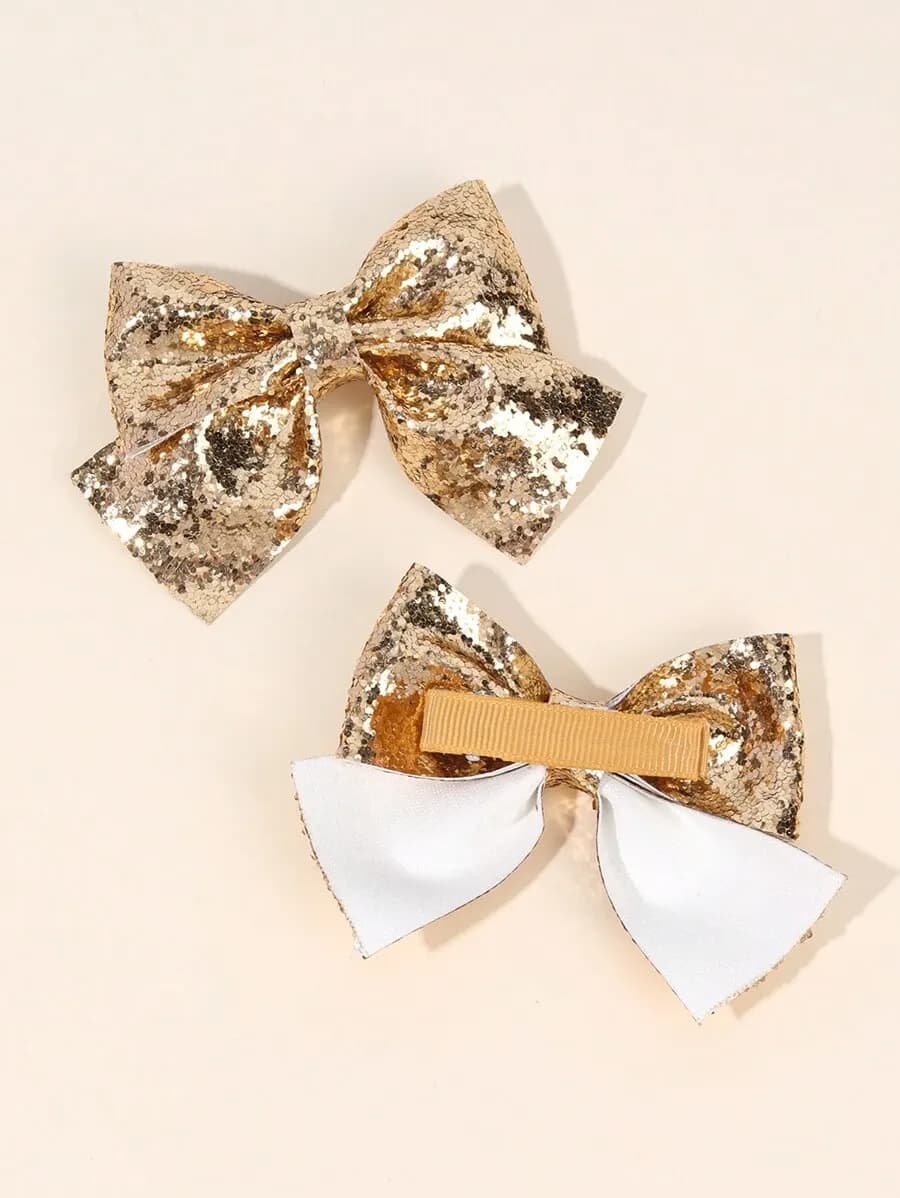 Set de 2 Lazos Brillantes con Lentejuelas Doradas para Niñas – Ganchos Tipo Alligator